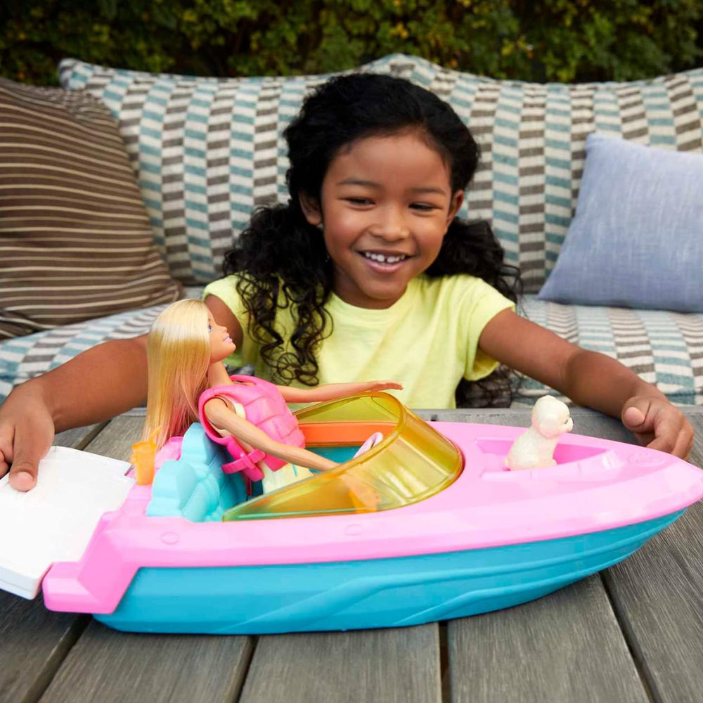 Barbie Doll & Toy Boat Playset with Pet Puppy, Life Vest & Beverage Accessories. This playset features a Barbie doll, boat, and accessories, sparking imaginative role-playing and offering children endless storytelling adventures. GRG30 thumbnail
