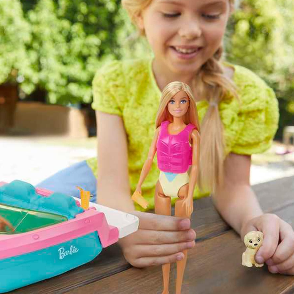 Barbie Doll & Toy Boat Playset with Pet Puppy, Life Vest & Beverage Accessories. This playset features a Barbie doll, boat, and accessories, sparking imaginative role-playing and offering children endless storytelling adventures. GRG30 thumbnail