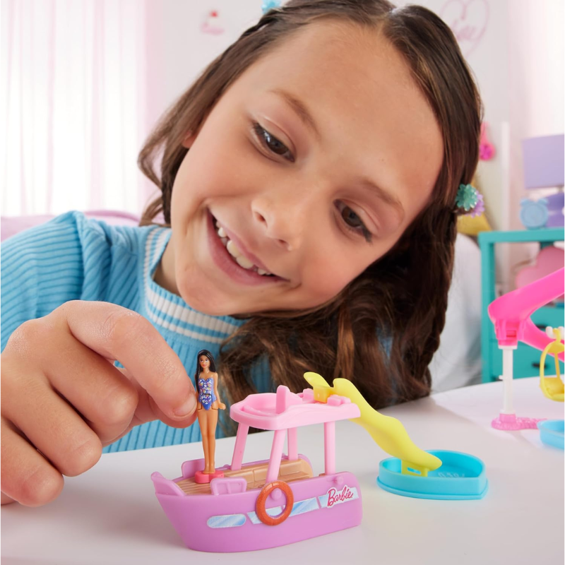 Barbie Mini BarbieLand Playsets with Toy Vehicle & 1.5-inch Doll, Dream Boat. The Dream Boat includes a thrilling color-change feature, adding an interactive element that sparks children's creativity and inspires imaginative storytelling. HYF41 thumbnail