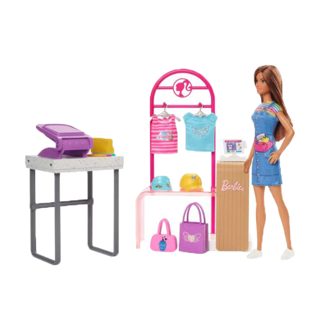 Barbie Make & Sell Boutique Playset with Brunette Doll, Foil Design Tools, Clothes & Accessories. Kids can stitch their way into the fashion world with the Barbie Make & Sell Boutique playset! HKT78 thumbnail