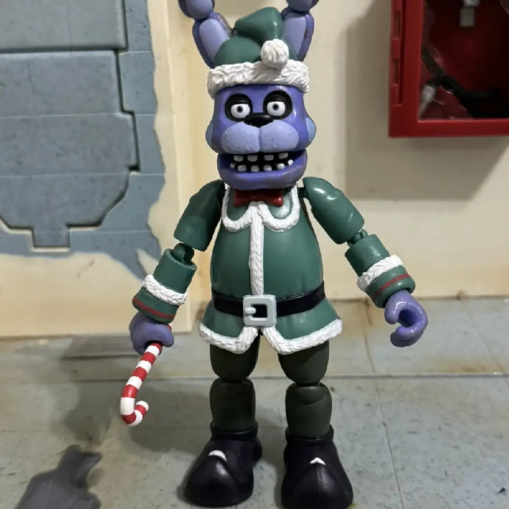 Funko Action Figure: Five Nights at Freddy's- Holiday Bonnie The Rabbit. Holiday Bonnie represents a fan-favorite from the FNAF franchise, attracting collectors who appreciate genuine and nostalgic pieces. F-72481 thumbnail