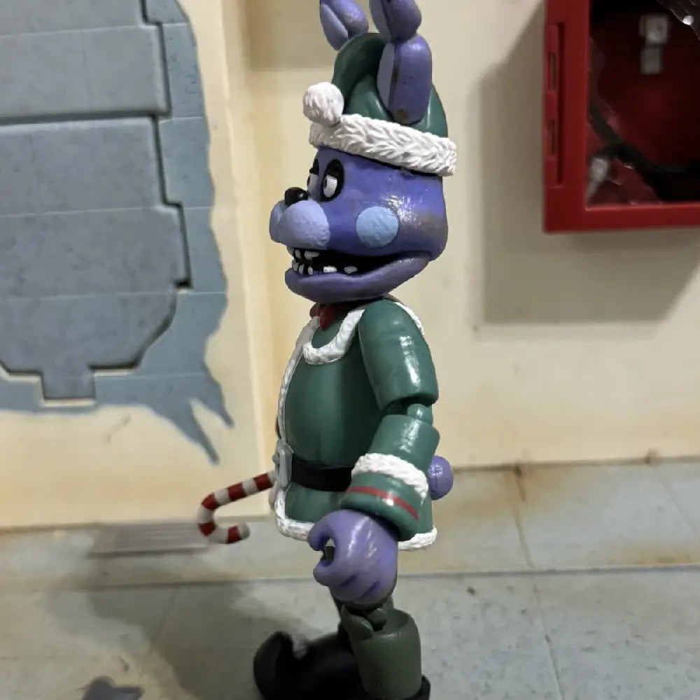 Funko Action Figure: Five Nights at Freddy's- Holiday Bonnie The Rabbit. Holiday Bonnie represents a fan-favorite from the FNAF franchise, attracting collectors who appreciate genuine and nostalgic pieces. F-72481 thumbnail
