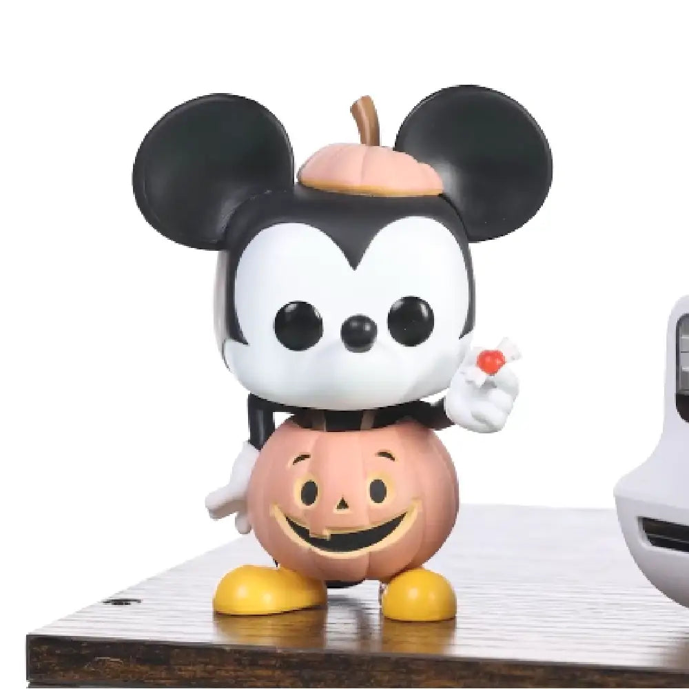 Funko POP Disney: Disney Mickey Trick or Treat (GLOW) EXCLUSIVE.  This figure boasts a glow-in-the-dark feature that adds an enchanting touch to any collection, making it especially fun for nighttime display.  F-65035 thumbnail