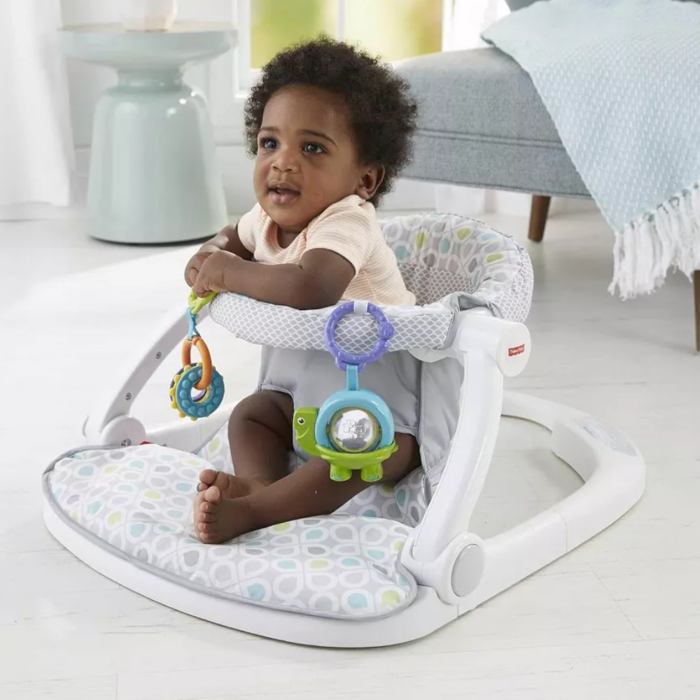 Fisher-Price Portable Baby Chair Sit-Me-Up Floor Seat With Developmental Toys. The Sit-Me-Up Floor Seat is thoughtfully designed to support healthy posture in infants, providing comfort and stability during playtime while keeping your baby safe. GGD48 thumbnail