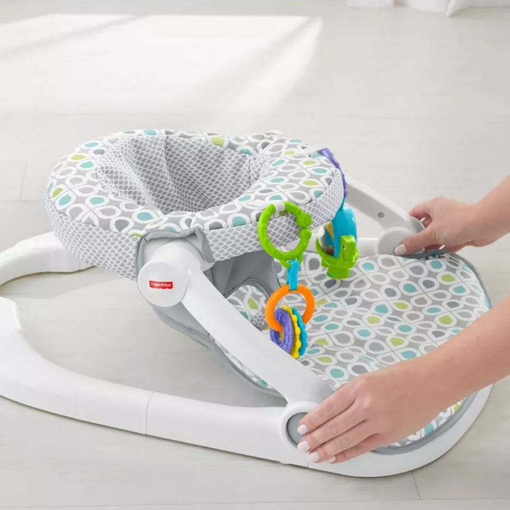 Fisher-Price Portable Baby Chair Sit-Me-Up Floor Seat With Developmental Toys. The Sit-Me-Up Floor Seat is thoughtfully designed to support healthy posture in infants, providing comfort and stability during playtime while keeping your baby safe. GGD48 thumbnail