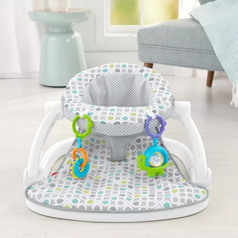 Fisher-Price Portable Baby Chair Sit-Me-Up Floor Seat With Developmental Toys. The Sit-Me-Up Floor Seat is thoughtfully designed to support healthy posture in infants, providing comfort and stability during playtime while keeping your baby safe. GGD48 thumbnail